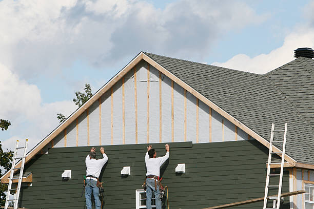 Professional Storm Damage Siding Repair technician working in Lake Milton, OH